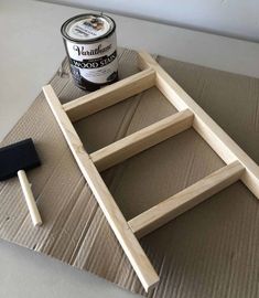 the paint is being used to make an old window frame with some wood and glue