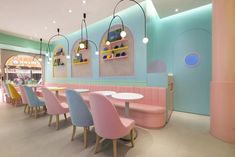 the interior of a restaurant with pastel colors