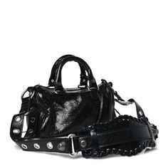 This is an authentic BALENCIAGA Agneau Arena Mini Le Cagole Duffle Crossbody Bag in Black. This stylish handbag is crafted of black calfskin leather with classic Balenciaga studs and buckles. The bag features a removable heart-shaped mirror and zip pouch, sturdy leather top handles with braided detail, and an adjustable shoulder strap. The top unzips to a black fabric interior. Balenciaga Coat, Pop Stitch, Black Balenciaga, Shaped Mirror, Crossbody Bag Black, Everyday Tote, Balenciaga Bag, Mini Purse, Zip Pouch