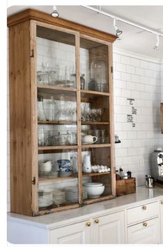 a kitchen filled with lots of white appliances