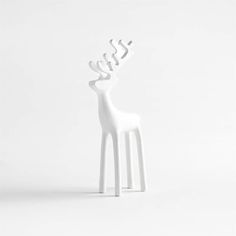 A zinc-white finish gives our signature reindeer a wintry silhouette. Long-legged with stylized antlers, our modern take on this holiday favorite is made of hand-cast aluminum. Clean and contemporary, the small reindeer looks amazing on its own or grouped as a herd with its medium and large counterparts. The white reindeer is a Crate & Barrel exlusive.  White Holiday Reindeer Decoration 9" 8.75 " H height 3.25 " W width 1.25 " D depth Measurements are in inches.   * Hand-cast aluminum   * Zinc-white finish   * Wipe clean with soft, dry cloth   * Made in India Reindeer Sculpture, Wood Reindeer, Reindeer Decoration, Snowflake Cutouts, Christmas Entryway, Porcelain Candle Holder, White Reindeer, Porcelain Candle, Faux Snow