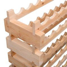 several wooden wine racks stacked on top of each other