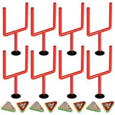 six red metal pegs with different designs on them