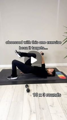 a woman is doing an exercise on a mat