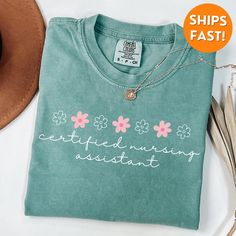 a t - shirt that says, everything is interesting with flowers on the front and back