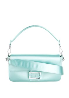 Fendi Tiffany & Co. Baguette Bag in signature Tiffany blue Silk Satin. Limited Edition, Rare…iconic. In excellent condition, Gently preowned with minimal signs of wear. Signs of wear include faint scratches to the silver hardware (hard to see or capture in photos, but please look closely), a faint darker mark underneath the front flap (not visible when worn), and a similar but smaller faint mark on the front top left corner, only visible in a certain light, which is why most photos here don’t show it, but I managed to take one where it’s more visible. Interior is clean and no snags or marks. This sold out, iconic collectors bag comes with the detachable short hand strap, longer crossbody strap, original authenticity card/tag, and the original Tiffany blue collectors box. Here’s your chance Trendy Luxury Light Blue Bag, Blue Fendi Baguette, Luxury Light Blue Shoulder Bag With Single Compartment, Light Blue Bags With Silver-tone Hardware, Luxury Light Blue Bags With Silver-tone Hardware, Dark Mark, Baguette Bag, Tiffany Blue, Blue Bags