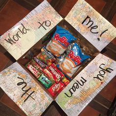 some candy and maps are on the floor with words that spell out what's in them