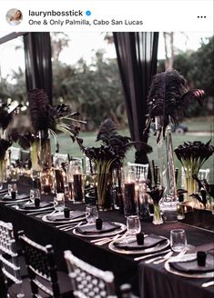 an image of a table setting with flowers and candles