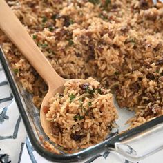 a casserole dish filled with rice and meat