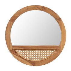 a round mirror that is made out of wood and has woven bamboo around the edges