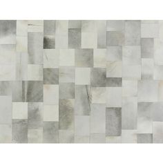 a white and grey tile wallpaper with squares on the bottom, in shades of gray