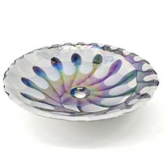 a glass bowl shaped like a peacock's tail