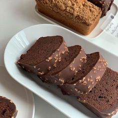 slices of chocolate cake sitting on top of white plates