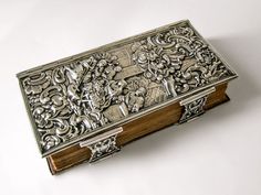 an ornate metal box sitting on top of a table