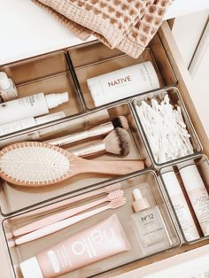 the drawers are organized with beauty products and personal care items