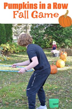 a young boy is playing with pumpkins in a row fall game for kids to play outside