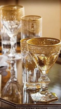 three glasses sitting on top of a tray