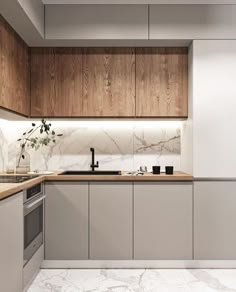 a modern kitchen with marble counter tops and wooden cabinetry, along with white walls