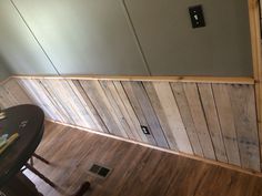 a room with wood paneling on the walls