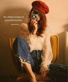 a woman sitting in a chair holding a camera up to her face with the caption be a better version of yourself everyday