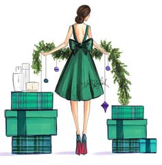 a woman in a green dress standing next to presents