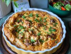 a quiche with meat and cheese in a pie dish