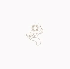 a hand holding a dandelion with the sun and moon in it's center