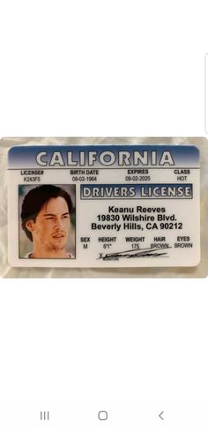 an id card with the name of a driver on it, in front of a white background