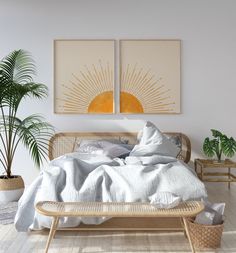 a bed with white sheets and pillows in a room next to two potted plants