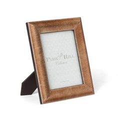 a wooden frame with the word park hill written in white and brown lettering on it