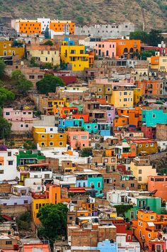 the colorful buildings are all over the hill in this city, and it looks like they have been painted