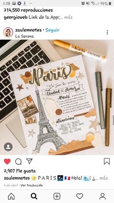 an instagram page with the word paris on it, next to a laptop and pens