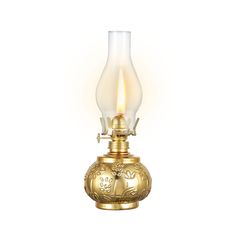 an antique brass lamp with a glass shade on the top and bottom, lit by a single candle