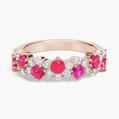 14k rose gold enhances the fiery glow of these round rubies as they emanate from a delicate garland of diamonds that weaves around in an elegant curving line giving this ring a romantic contemporary look. Ruby And Diamond Ring, Pink Sapphire Ring, Christmas Cookies Decorated, Cookies Decorated, Ruby Ring, Precious Gemstones, A Romantic, Pink Sapphire, Christmas Cookies