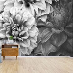 a black and white flower wall mural in a living room