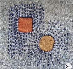 an applique on the back of a pair of jeans with holes in it