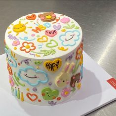 a decorated cake sitting on top of a table