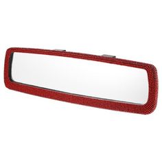 a red car mirror that is on the side of a white wall