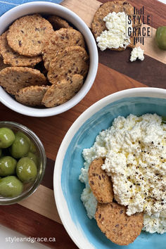 A blue bowl of homemade ricotta cheese is seen from above, drizzled with olive oil and sprinkled with freshly cracked black pepper.  The bowl sits on a wood serving bowl, surrounded by crisp crackers and bright green olives. Homemade Ricotta Cheese, Homemade Ricotta, Budget Family Meals, Family Baking, Family Meal Planning, Recipes Appetizers And Snacks, Ricotta Cheese, Style And Grace, Original Recipe