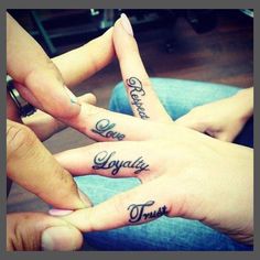 three people with their hands in the shape of fingers that say love, joy and trust