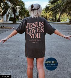 "Jesus Loves You Comfort Colors Christian Shirt 👉 QUICK FACTS 👈 Unisex Garment-Dyed T-shirt Comfort Colors® 1717 100% ring-spun cotton. Sizing is true to size RELAXED FIT - Size up 1-2 sizes for oversized look 👉HOW TO ORDER:👈 1. Please, Check and Review all Photos. 2. Select Your Size and Color from drop down menus. 3. Choose Your Quantity as much as you want. 4. Click \"Add To Cart\". For multiple items go back to the listing and repeat the steps. 👉Sizing Chart 👈 Use the sizing chart to understand the measurement of our Hoodies. 👉Care Instructions 👈 Machine wash: cold (max 30C or 90F); Do not bleach; Tumble dry: low heat; Iron, steam or dry: low heat; Do not dryclean. 👉Returns👈 All items are made-to-order. Because of the nature of these items, unless they arrive damaged or defec Jesus Clothes, Scripture Shirt, Christian Merch, Christian Streetwear, Jesus Is King, Love Like Jesus, Jesus Tees, Bible Verse Shirt, Christian Tees