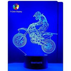 a motorcycle rider on a blue background is shown in the shape of a night light