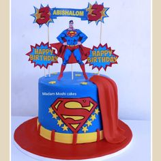 a birthday cake with a superman theme on it