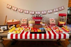 a red and white table topped with lots of food