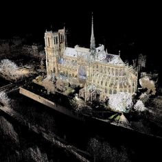 an aerial view of a large building at night