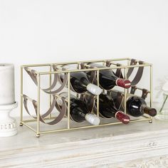 a wine rack with several bottles in it