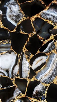 black and white marble with gold veining on it's edges, as seen from above