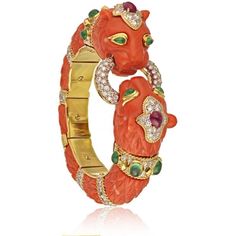 Capture the essence of timeless elegance with this exquisite David Webb Platinum & 18K Yellow Gold Carved Coral Bangle Bracelet. Crafted with meticulous attention to detail, this bracelet showcases the iconic animal motif that is synonymous with David Webb's distinguished design aesthetic.The centerpiece of this magnificent piece is the meticulously carved coral, a true testament to the brand's commitment to craftsmanship. The vibrant hues of the coral are beautifully accentuated by the contrast Animal Bracelets, Lion Head Bracelet, Lion Bracelet, Liz Taylor, Animal Instinct, David Webb, Coral Bracelet, Cuff Bangle Bracelet, Coral Jewelry