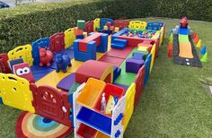 children's play area in the grass with toys