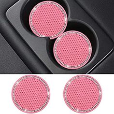 three pink car cup holders with diamond trims on the front and back of them